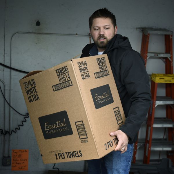 Alex Bata helps to load groceries onto a truck owned by the Rural Access Distribution co-op in North Dakota.