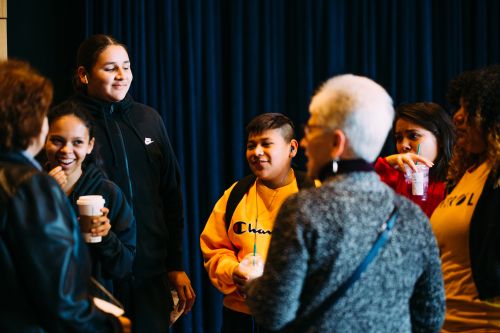Koepplinger visits with performers from the Ikidowin Youth Theatre Ensemble at the Indigenous People’s Task Force.