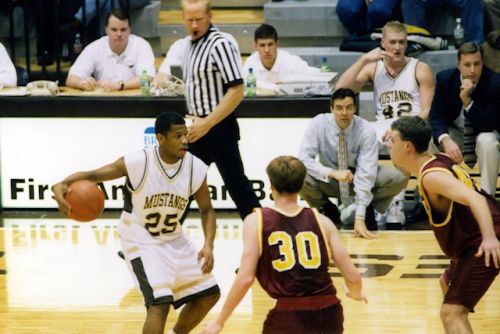 Michael playing basketball for Southwest Minnesota State
