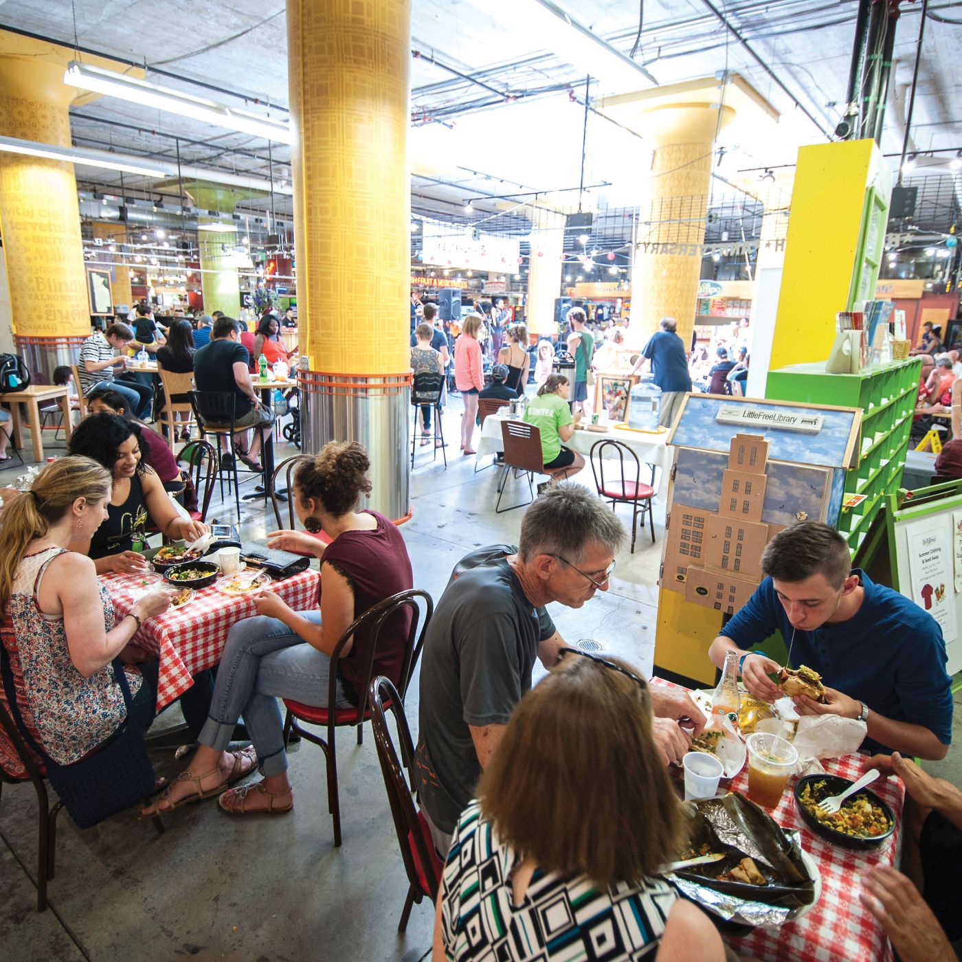 Patrons enjoy a variety of cuisines at Midtown Global Market, a key NDC project.