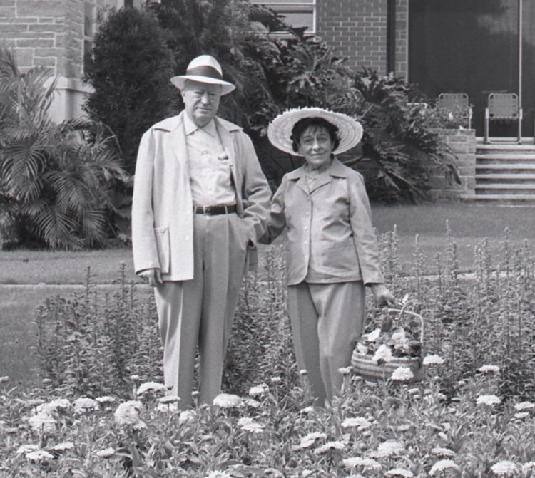 Archibald and Edyth Bush standing in a garden