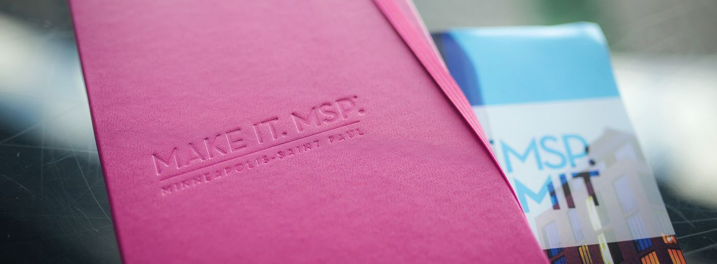 Pink notebook with a debossed logo for Make It MSP