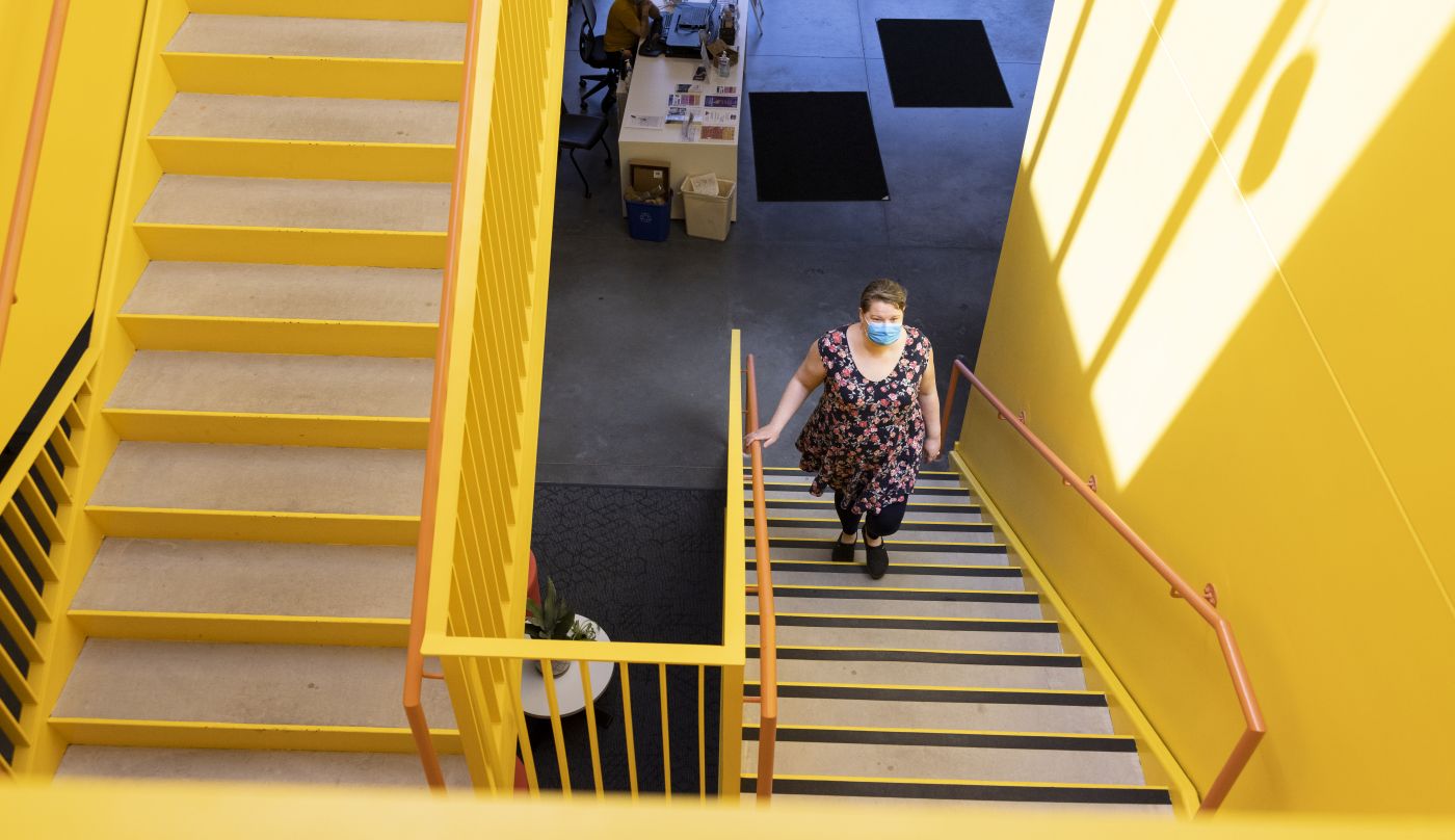 Family Tree Clinic employee Lindsey Hoskins ascends the stairs in the bright and welcoming new office.