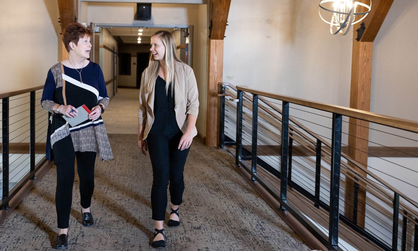 Diana Anderson and Baillee Krieger walk through halls of Bethesda