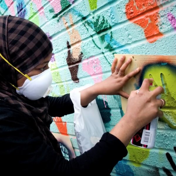 woman painting a mural