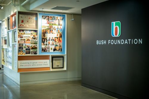 Our office space - wall with Bush logo